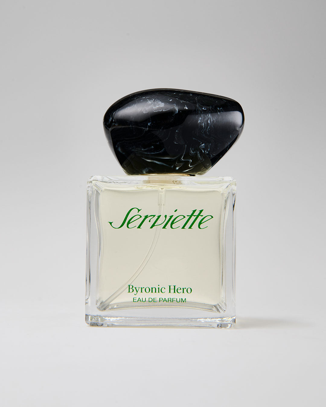 Perfume bottle labeled 'Serviette Byronic Hero' on a light gray background